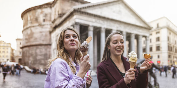 Woman eating icecream in Italy